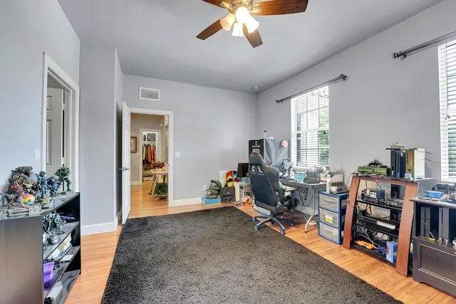 an aerial view of residential houses with outdoor space and river
