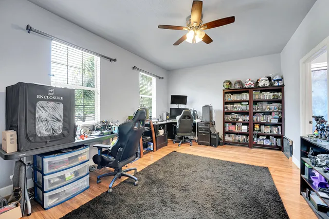 an aerial view of residential houses with outdoor space and street view