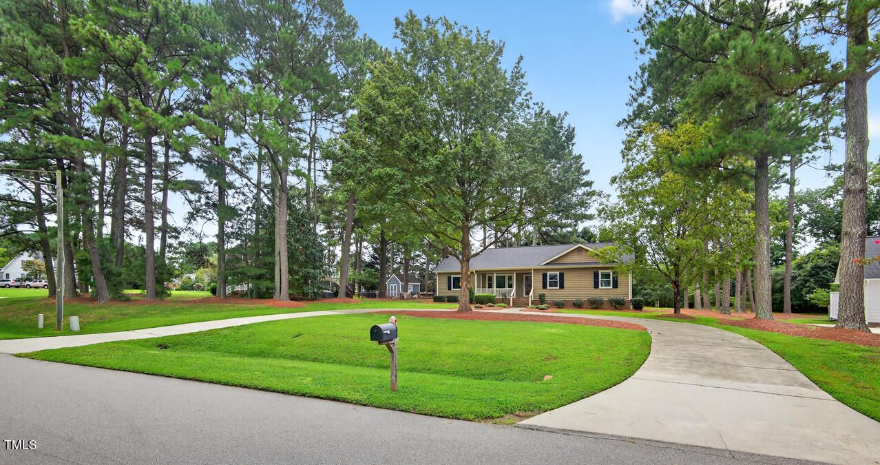2805 Dunkirk Drive Raleigh, NC 27613 - Photo 1 of 36 a front view of a house with garden