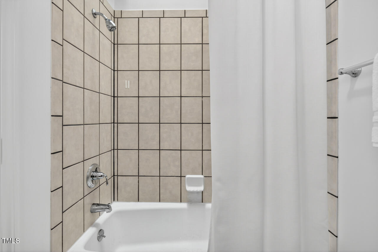 2805 Dunkirk Drive Raleigh, NC 27613 - Photo 25 of 36 a bathroom with a bathtub