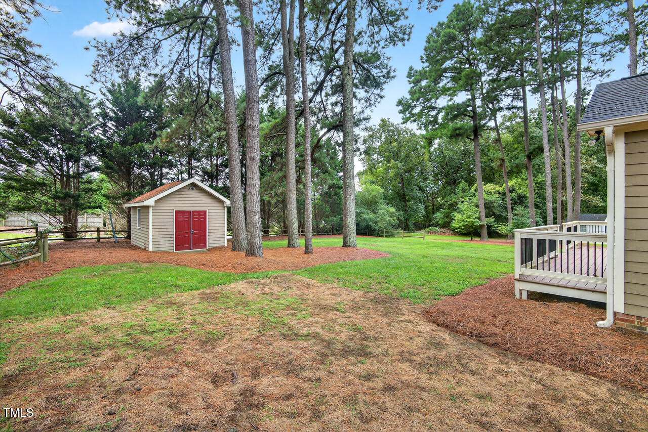 2805 Dunkirk Drive Raleigh, NC 27613 - Photo 26 of 36 a view of backyard of house with green space