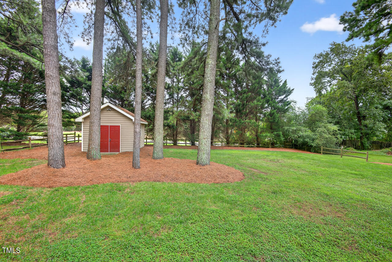 2805 Dunkirk Drive Raleigh, NC 27613 - Photo 30 of 36 a front view of a house with yard and green space