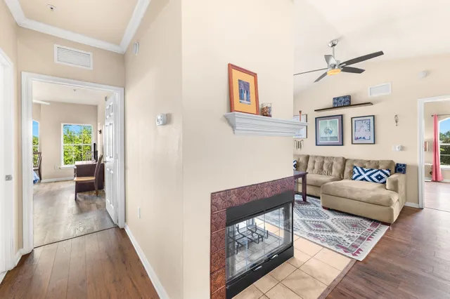 a spacious bathroom with a double vanity sink a mirror a toilet and a window