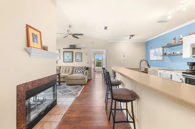 a living room with furniture and a fireplace