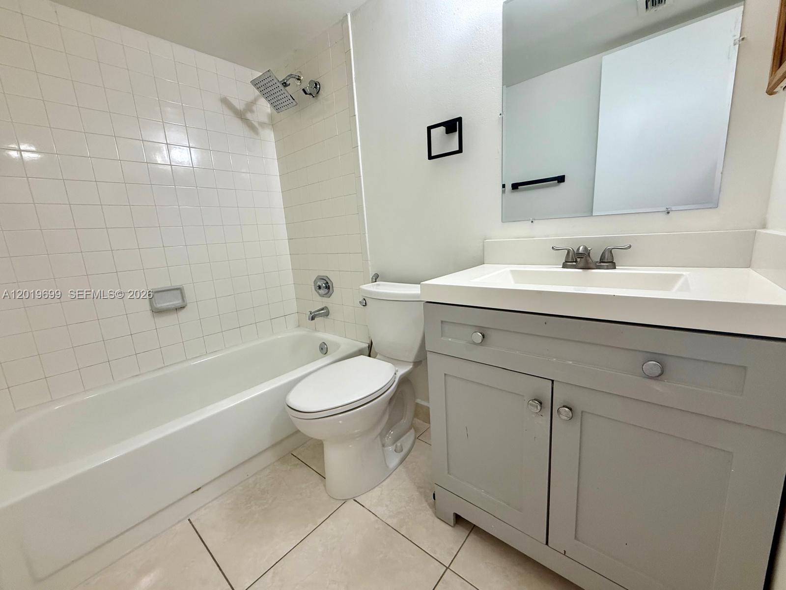 3470 Foxcroft Road, Unit 204 Miramar, FL 33025 - Photo 23 of 40 a bathroom with a sink a toilet and shower