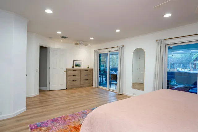 a bed room with a bed and a television