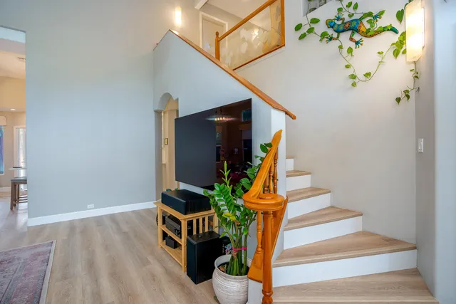 a view of entryway with paintings on the wall