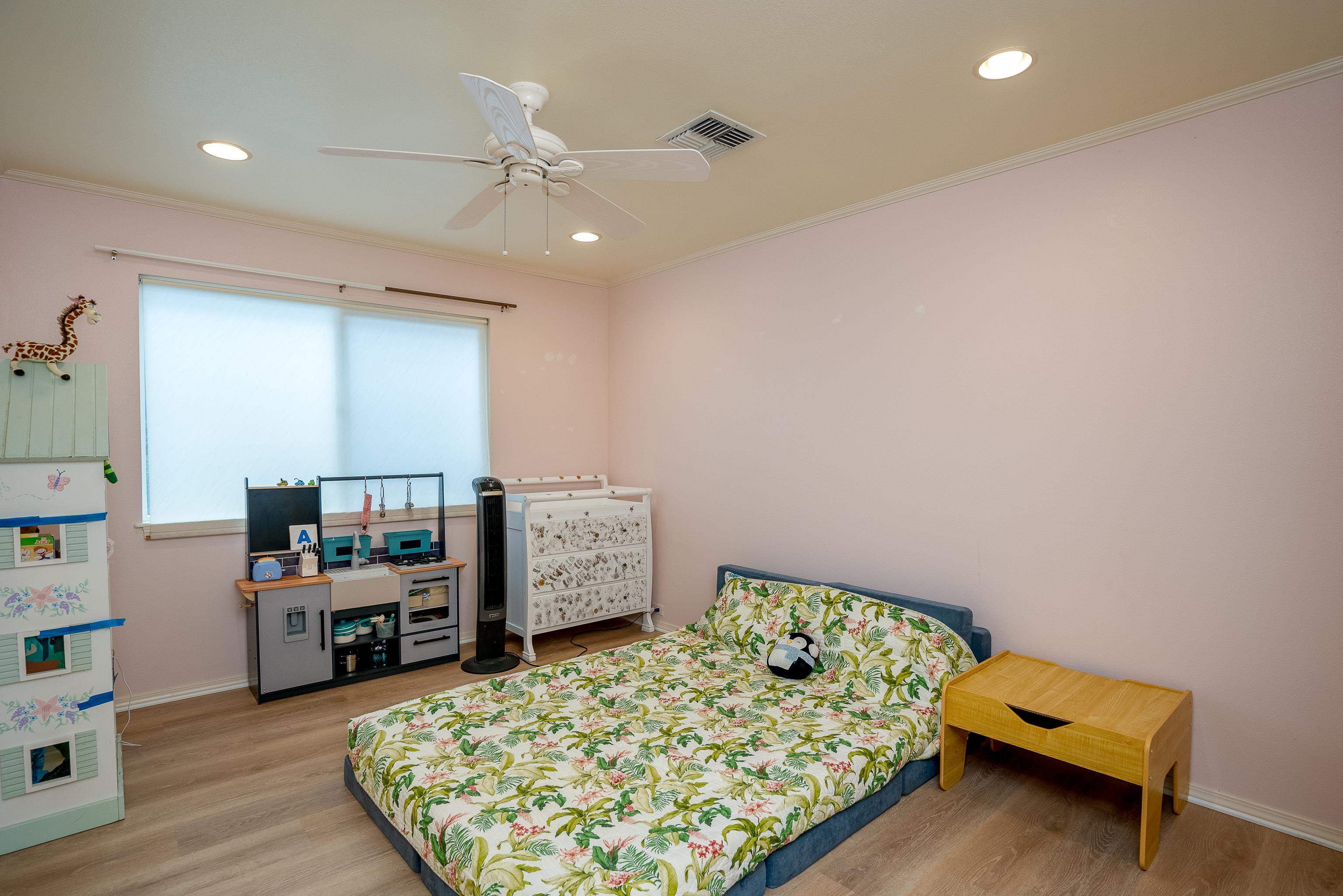 52 Kuukama Street Kahului, HI 96732 - Photo 24 of 28 a bedroom with furniture and a flat screen tv