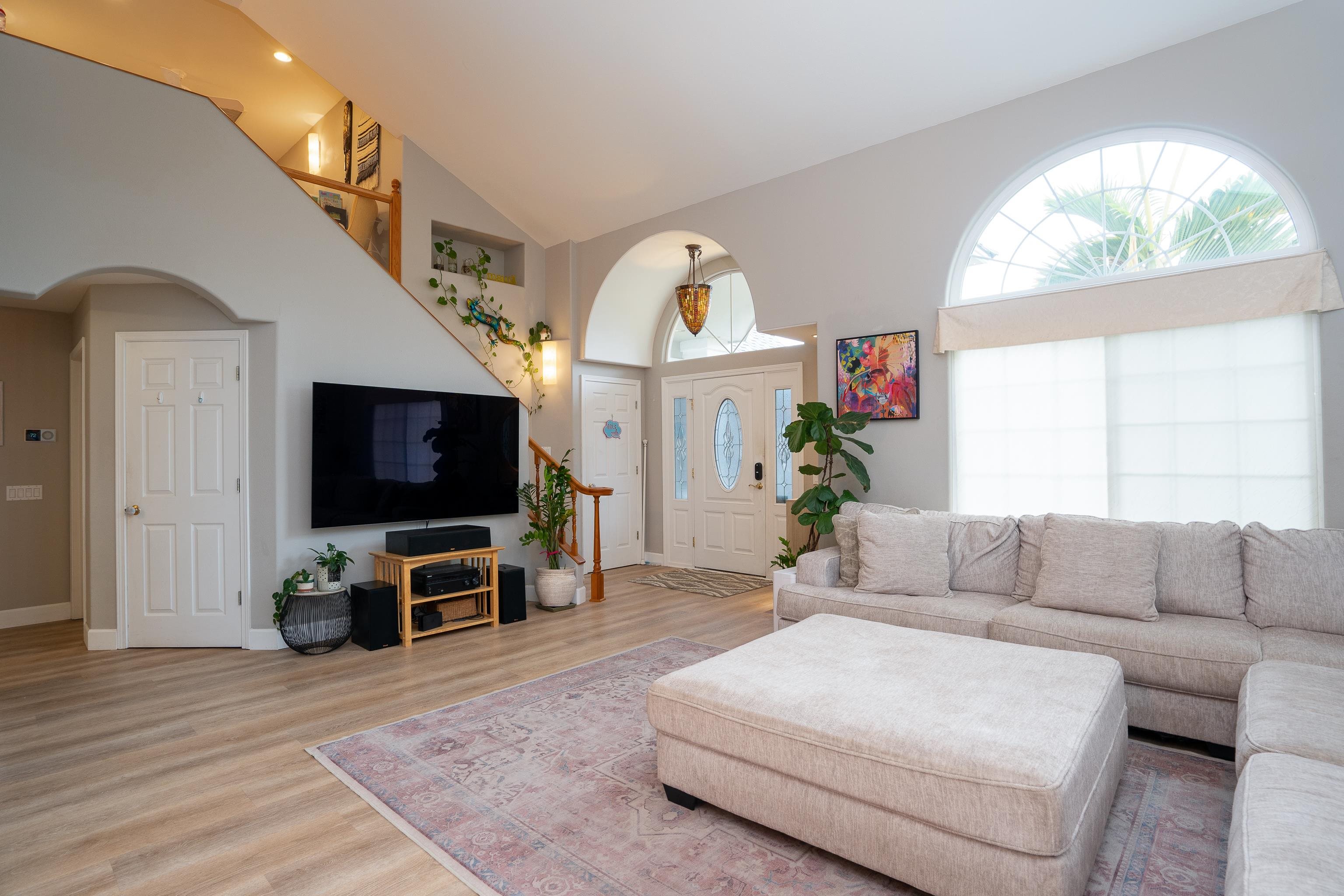 52 Kuukama Street Kahului, HI 96732 - Photo 7 of 28 a living room with furniture a flat screen tv and a large window