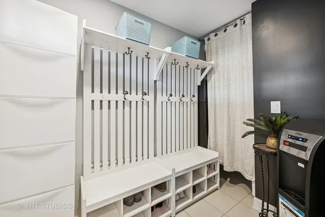 a bedroom with a bed next to a large window