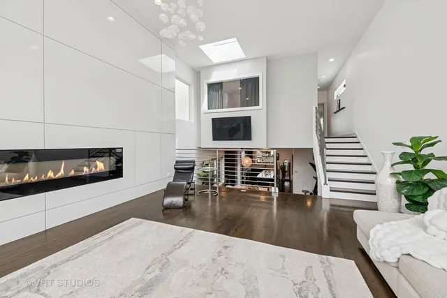 a lobby with furniture and flat screen tv