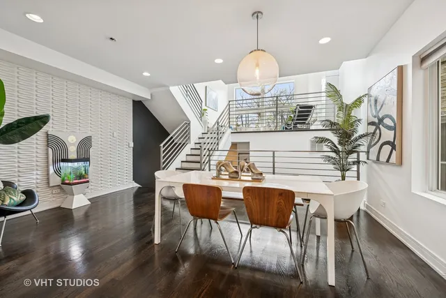 a view of dining room and hall with wooden floor