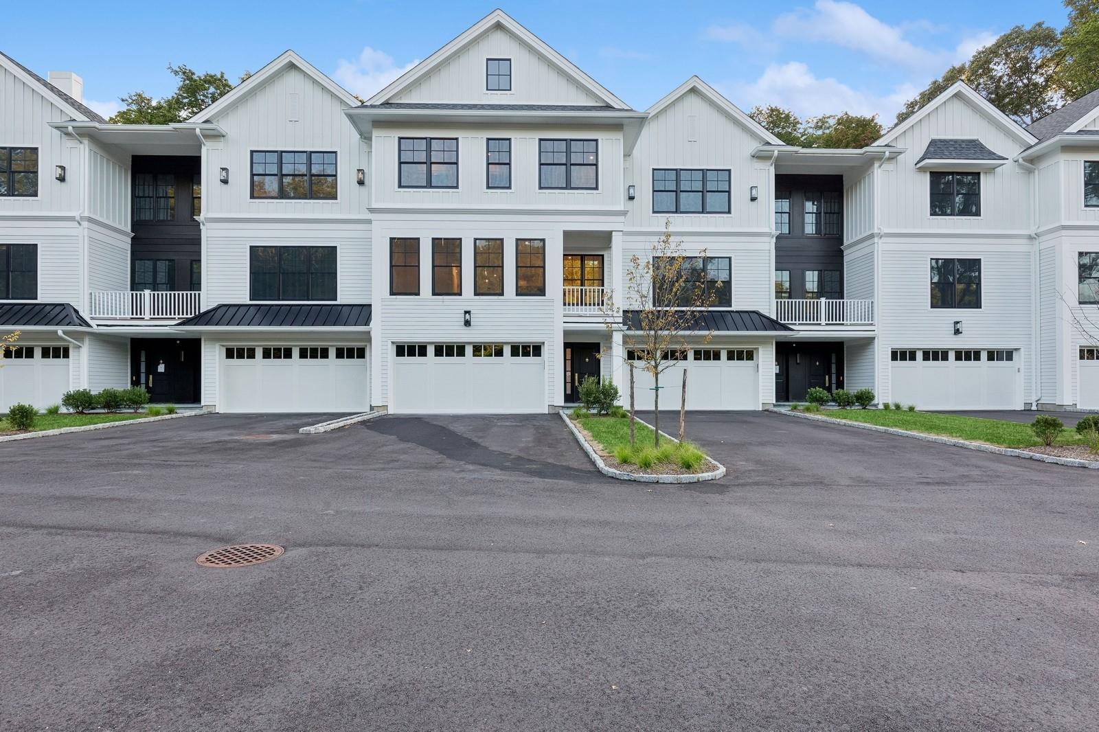 a view of multiple houses with a street