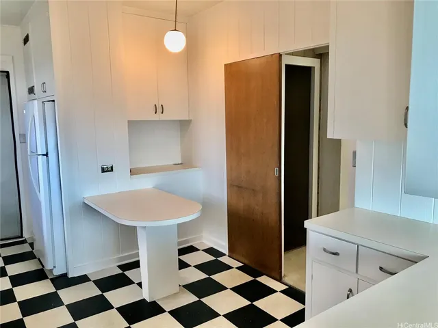 a bathroom with a sink a mirror and a shower