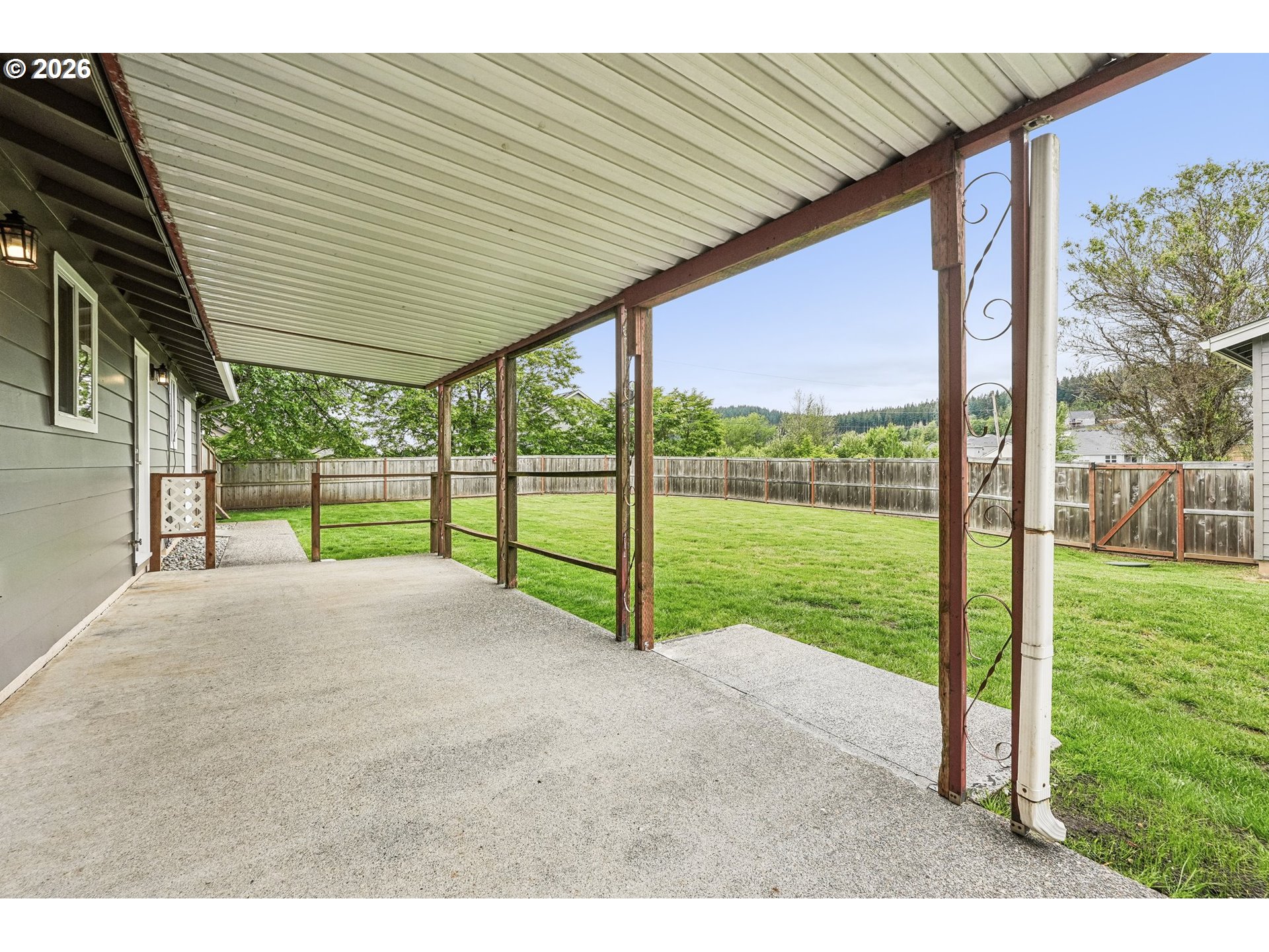 22600 Northeast 28th Street Camas, WA 98607 - Photo 29 of 48 a view of a backyard with floor to ceiling window next to a yard