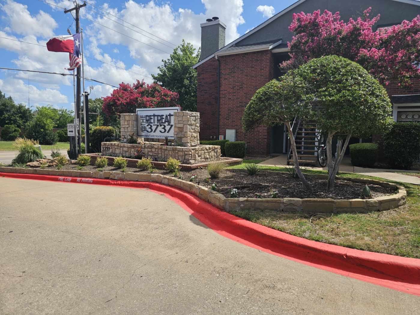 3737 Timberglen Road, Unit 701 Dallas, TX 75287 - Photo 14 of 19 a sign that is on the side of a road