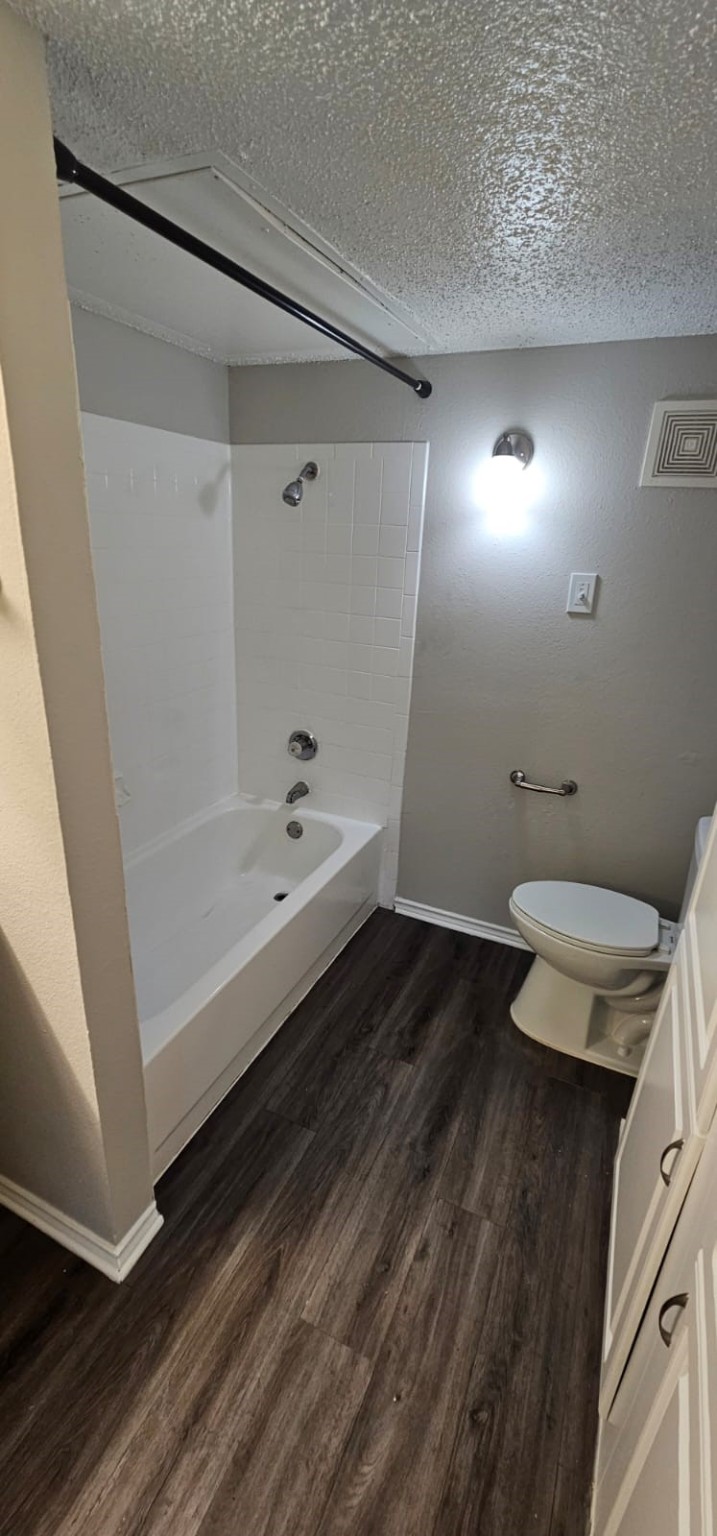 3737 Timberglen Road, Unit 701 Dallas, TX 75287 - Photo 5 of 19 a bathroom with a sink and a toilet