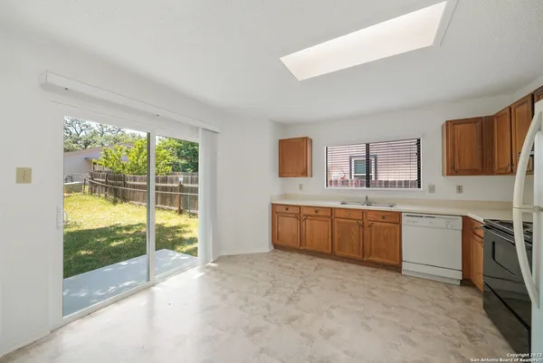 a large kitchen with a large window