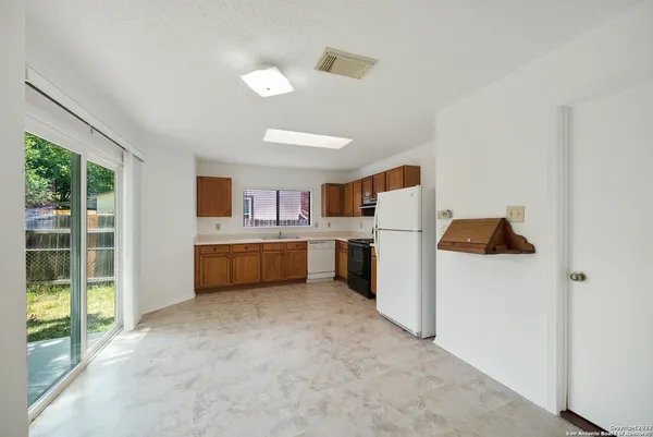 a kitchen with stainless steel appliances a refrigerator and a sink