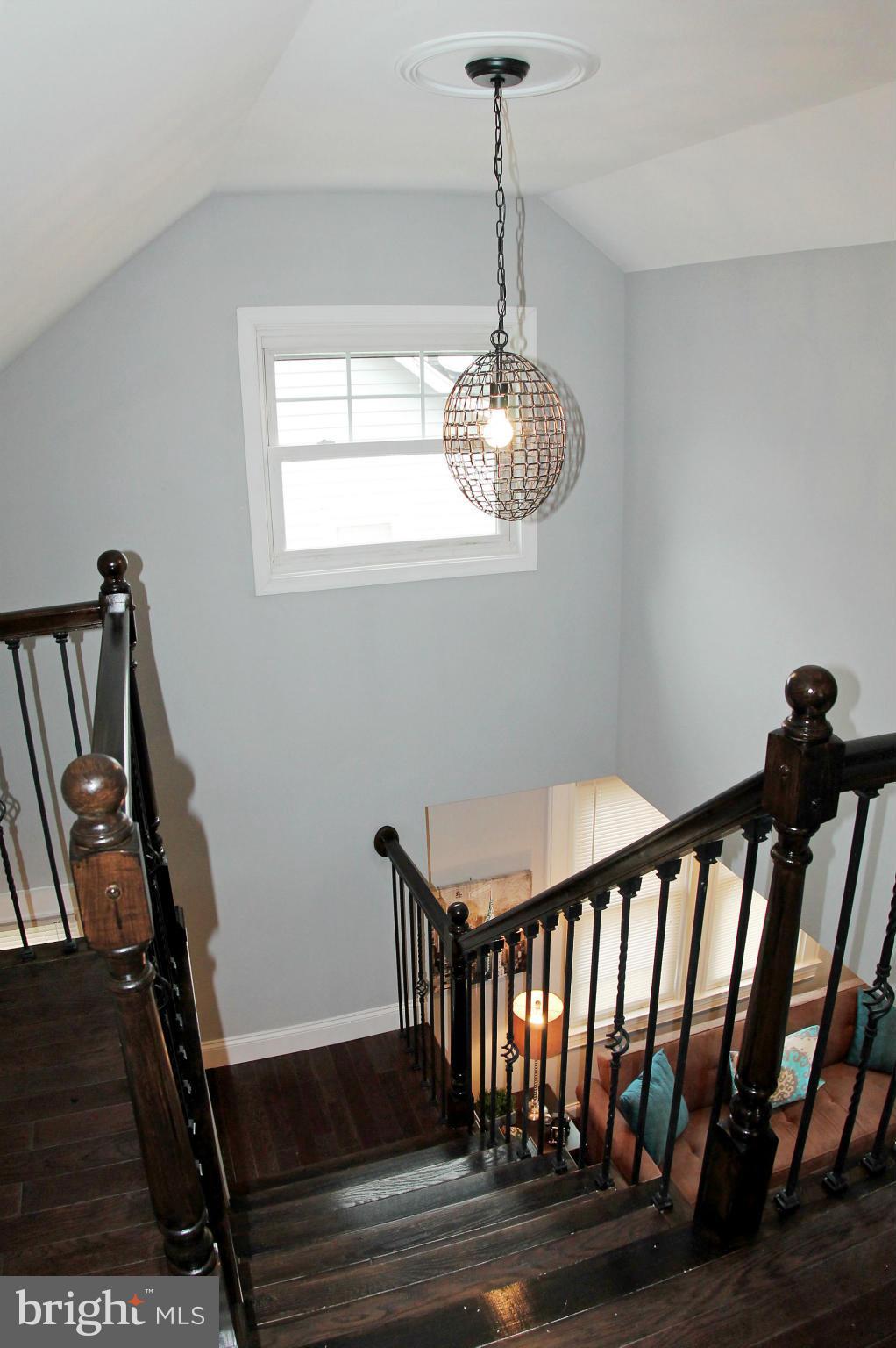 5510 Tramore Road Baltimore, MD 21214 - Photo 15 of 30 a view of a hallway with a chandelier
