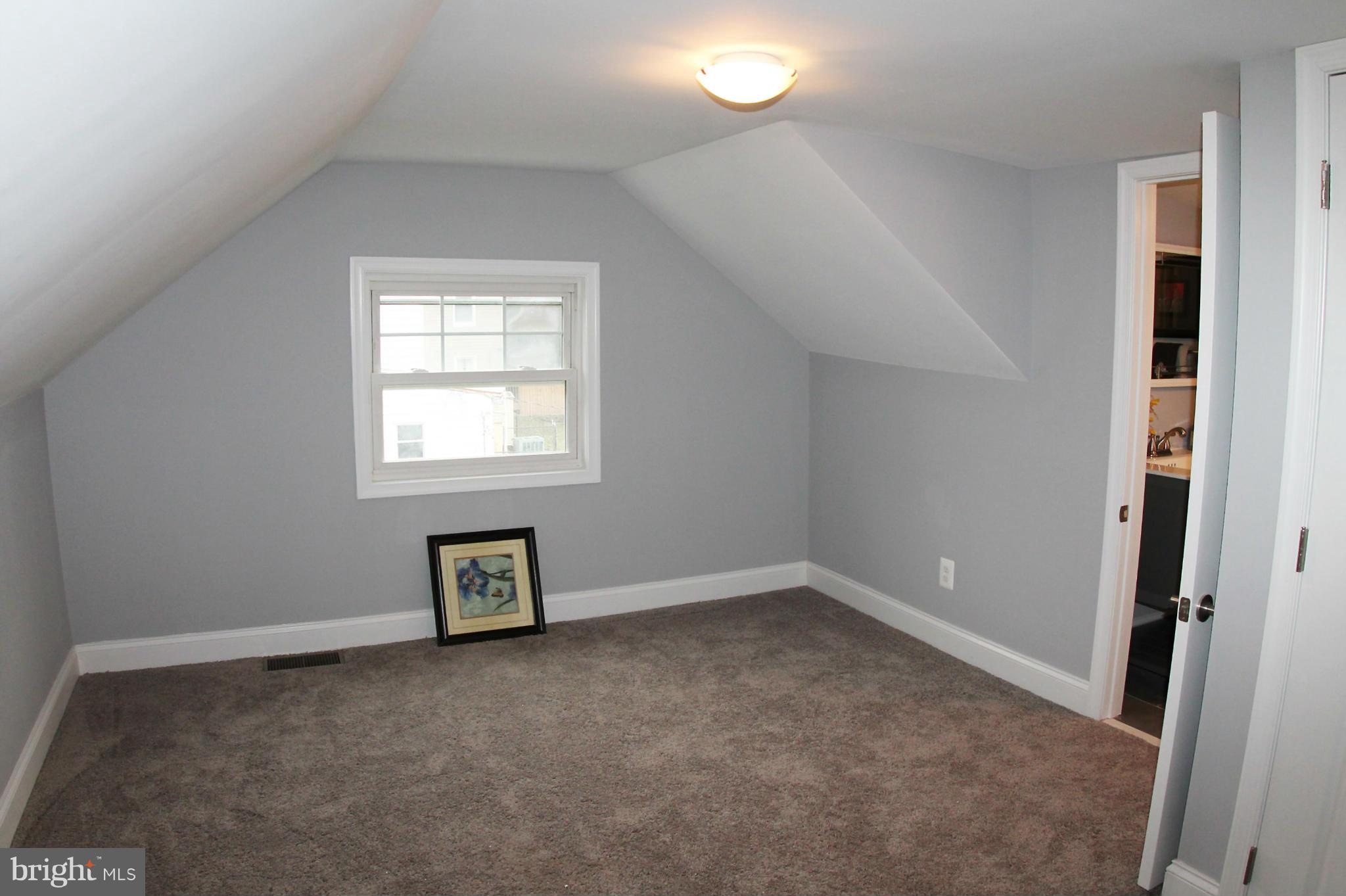 5510 Tramore Road Baltimore, MD 21214 - Photo 19 of 30 an empty room with a window