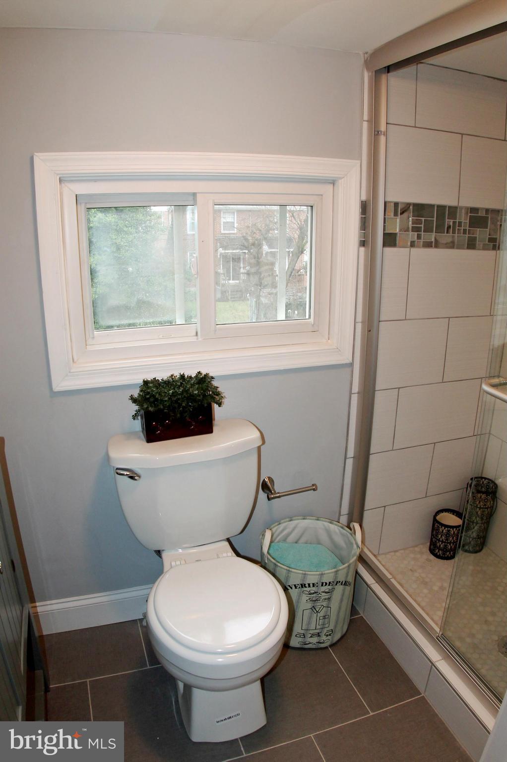 5510 Tramore Road Baltimore, MD 21214 - Photo 21 of 30 a bathroom with a toilet and a shower