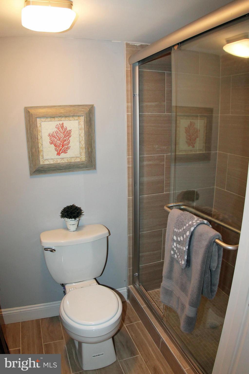 5510 Tramore Road Baltimore, MD 21214 - Photo 24 of 30 a bathroom with a toilet and a shower