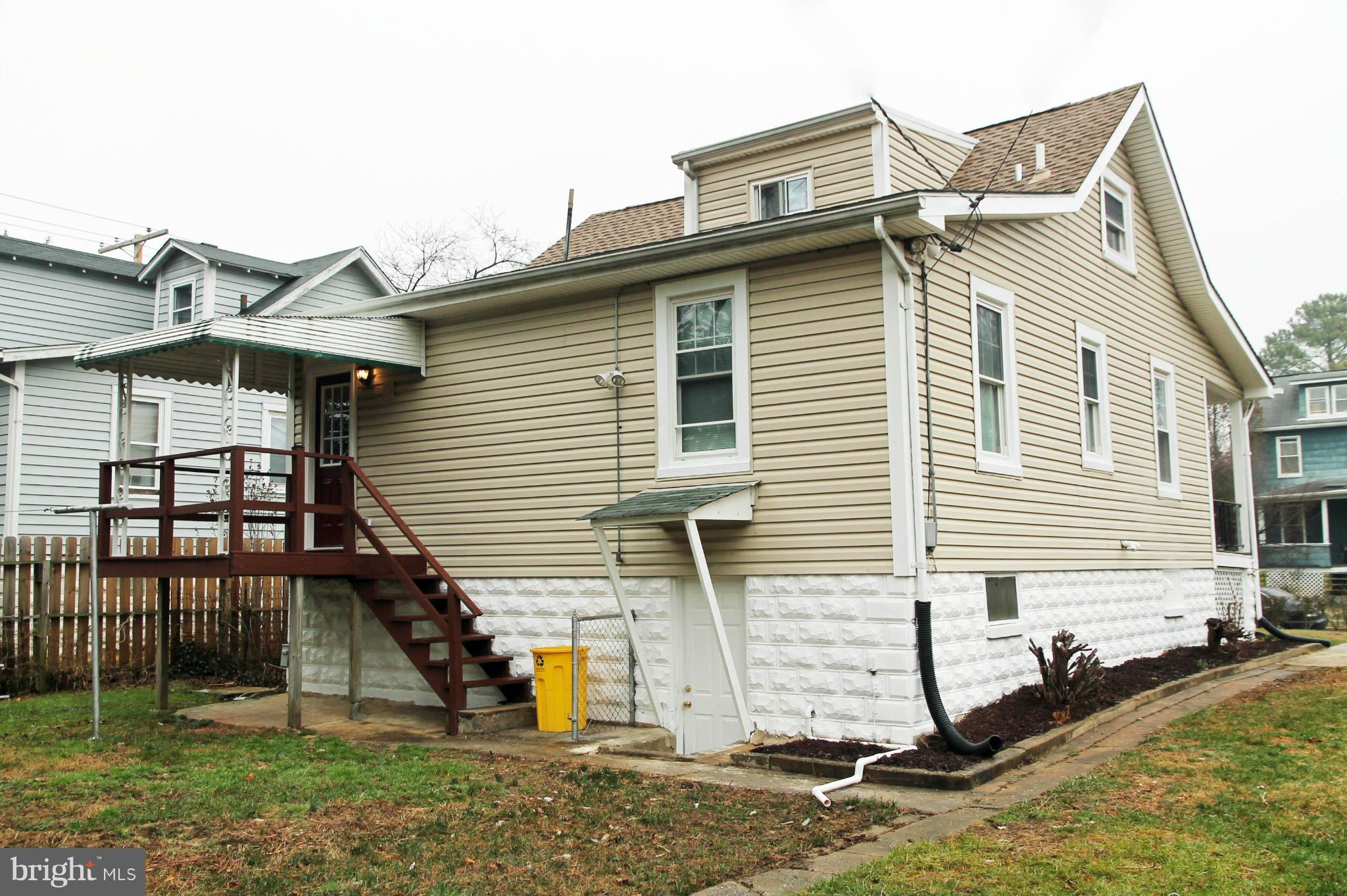 5510 Tramore Road Baltimore, MD 21214 - Photo 29 of 30 a view of a house with a yard and furniture