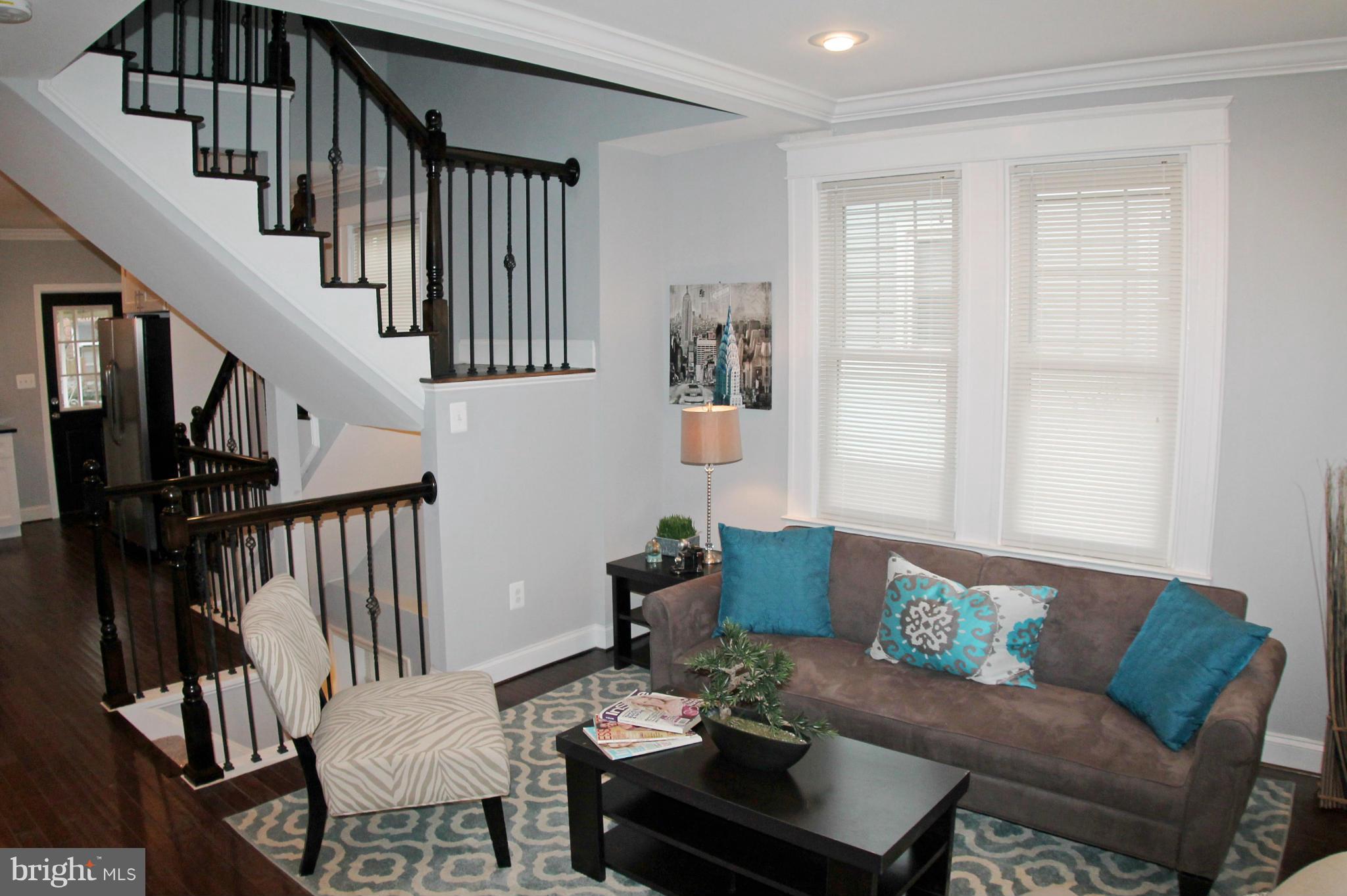 5510 Tramore Road Baltimore, MD 21214 - Photo 5 of 30 a living room with furniture and wooden floor