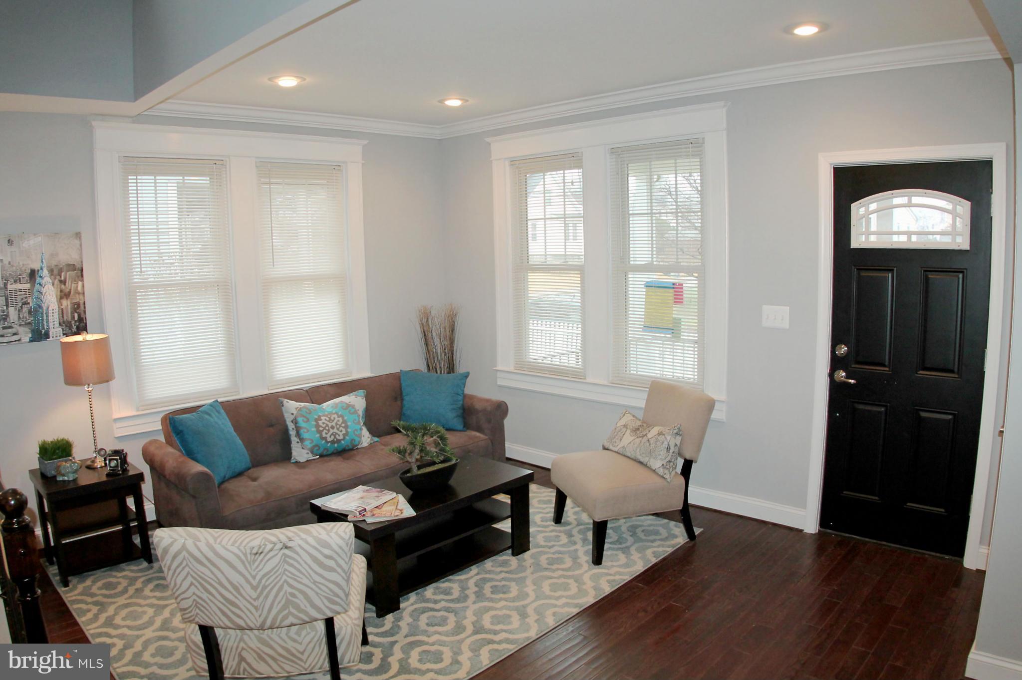 5510 Tramore Road Baltimore, MD 21214 - Photo 7 of 30 a living room with furniture and wooden floor