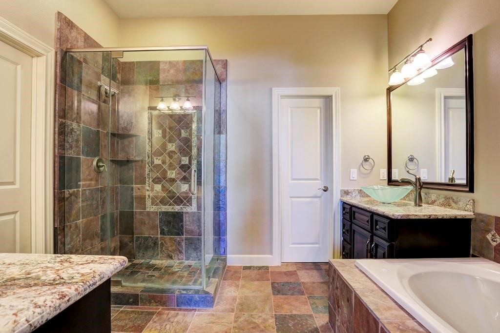 923 Birdsall Street Houston, TX 77007 - Photo 12 of 21 a bathroom with a granite countertop sink a mirror and shower