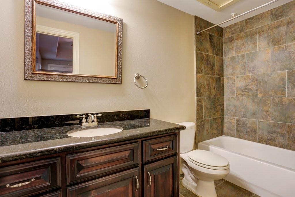 923 Birdsall Street Houston, TX 77007 - Photo 17 of 21 a bathroom with a sink a toilet and shower