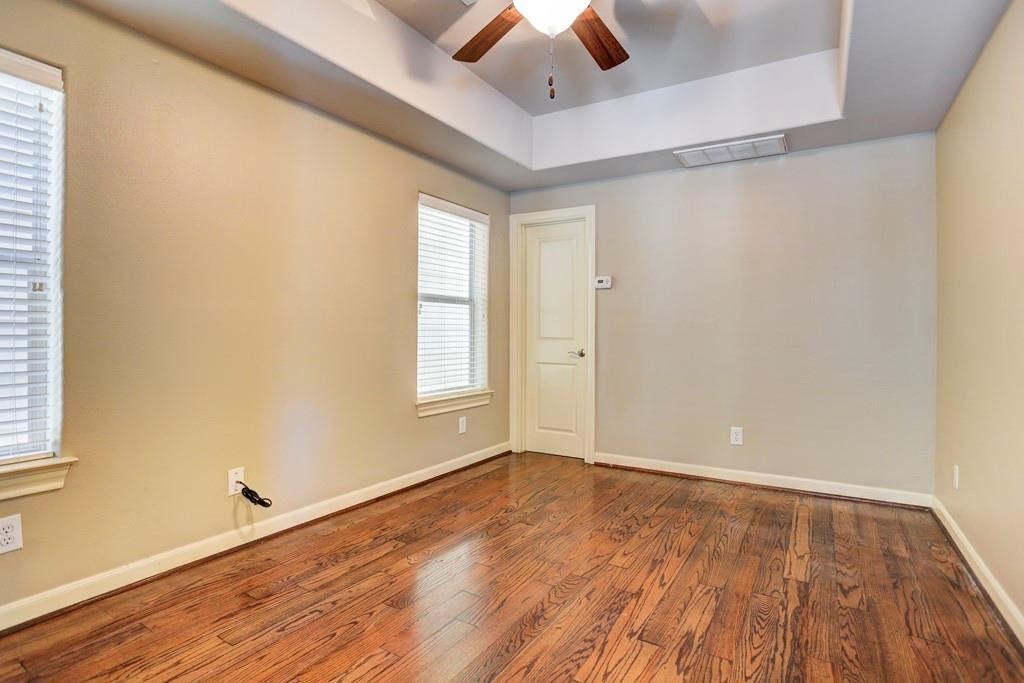923 Birdsall Street Houston, TX 77007 - Photo 19 of 21 wooden floor in an empty room with a window