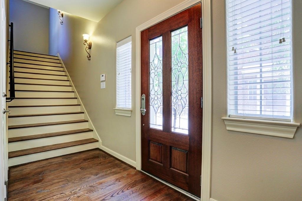 923 Birdsall Street Houston, TX 77007 - Photo 4 of 21 a view of a hallway with wooden floor and windows