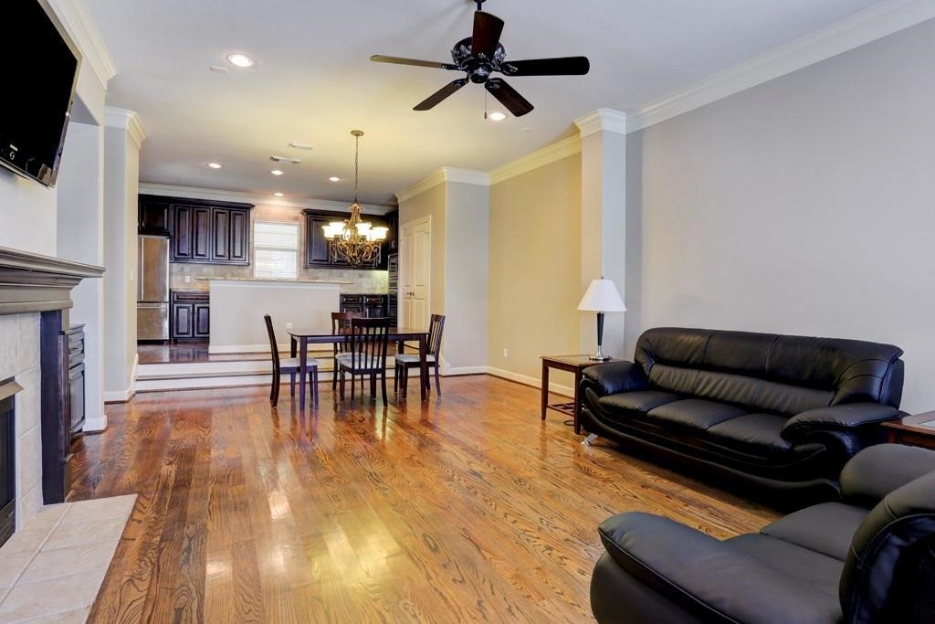 923 Birdsall Street Houston, TX 77007 - Photo 20 of 21 a living room with furniture and a fireplace