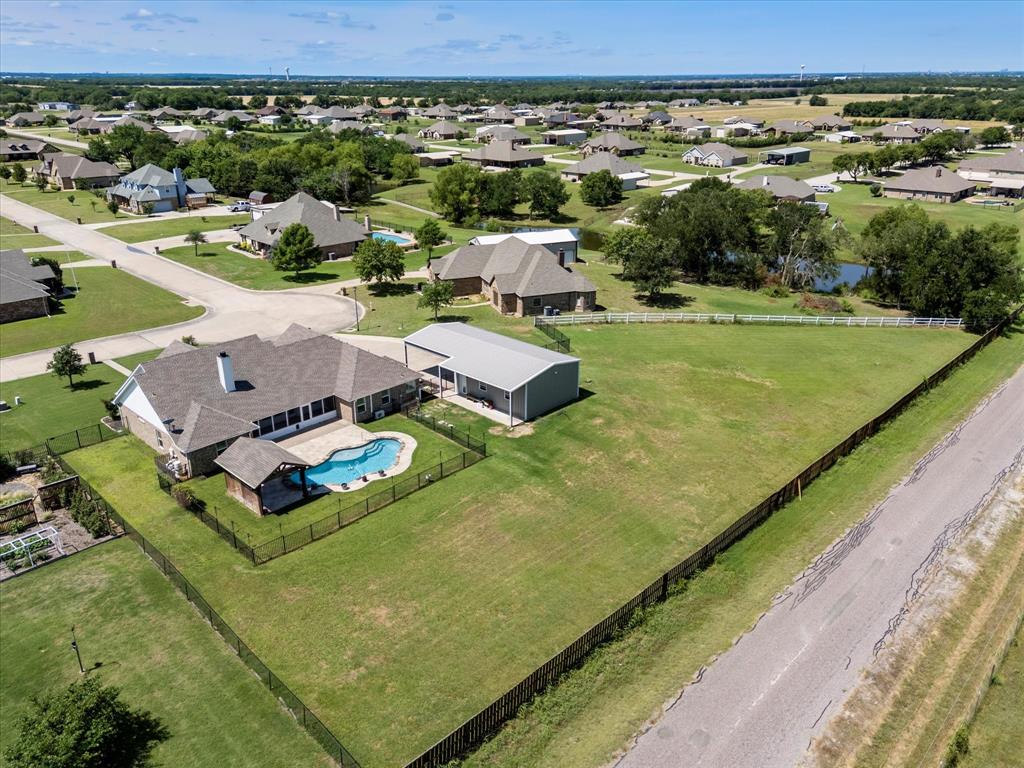 528 Hubbard Circle Nevada, TX 75173 - Photo 20 of 36 Aerial perspective of suburban area with a pool