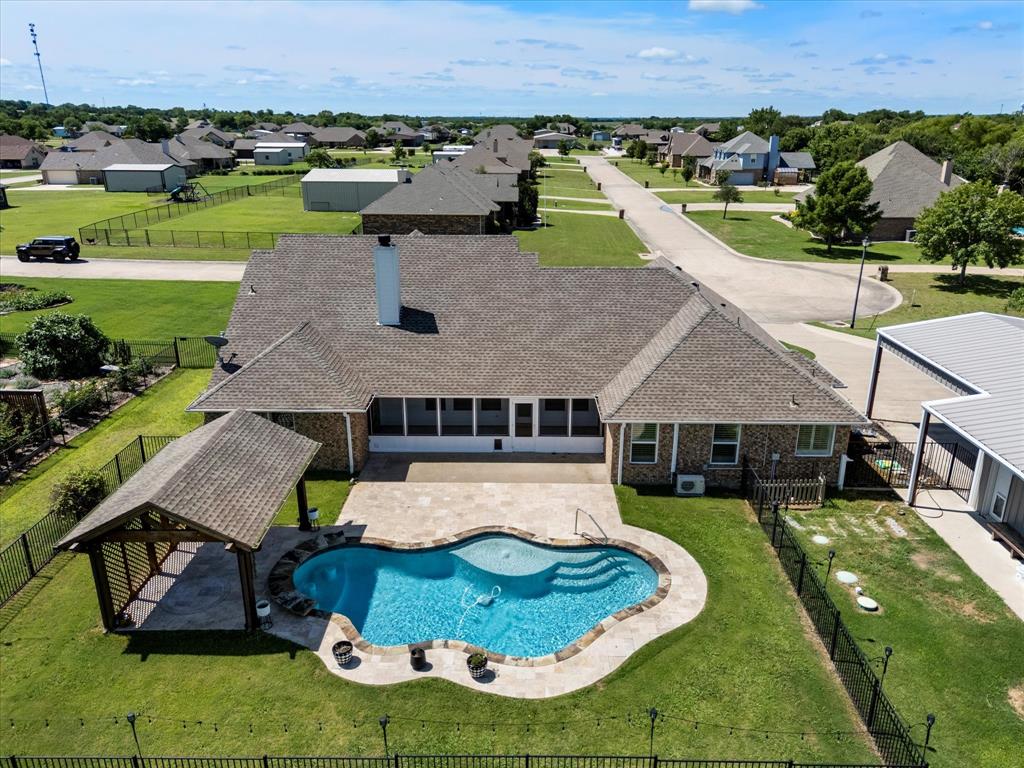 528 Hubbard Circle Nevada, TX 75173 - Photo 2 of 36 View of pool featuring a residential view and a patio