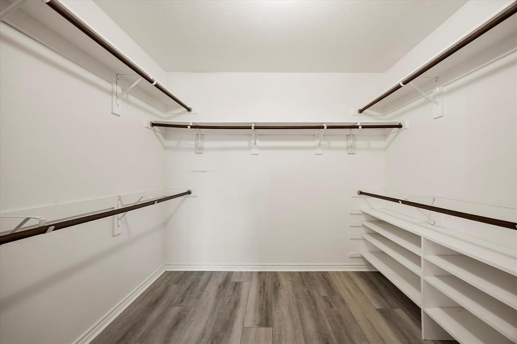 528 Hubbard Circle Nevada, TX 75173 - Photo 35 of 36 Spacious MASTER closet with wood finished floors
