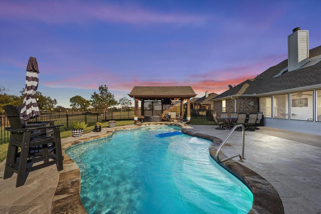 528 Hubbard Circle Nevada, TX 75173 - Photo 5 of 36 View of swimming pool with a gazebo, a fenced backyard, a patio, and outdoor dining space