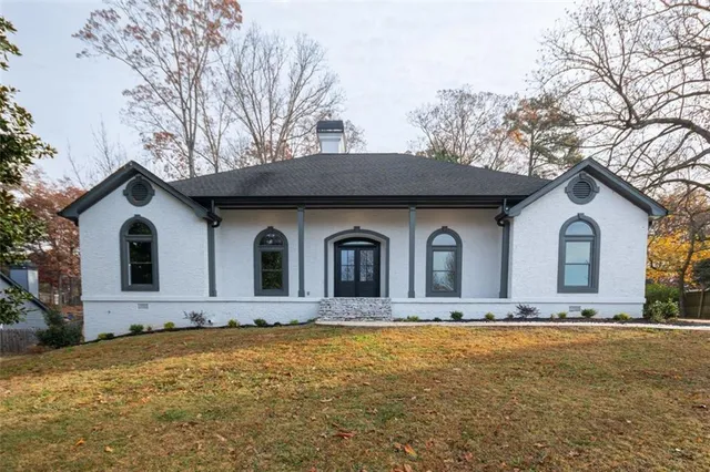 a front view of a house with yard
