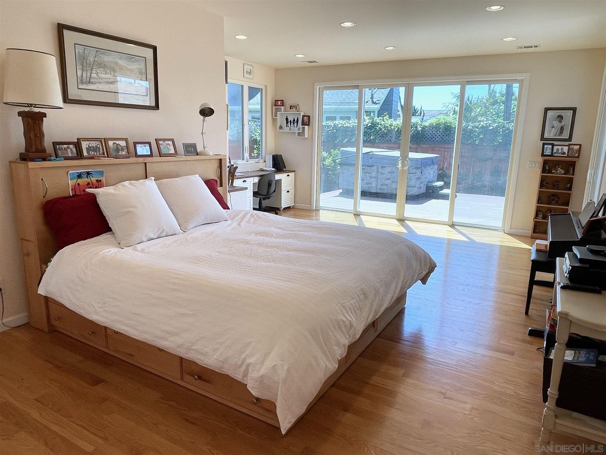 950 Cabrillo Avenue Coronado, CA 92118 - Photo 14 of 31 a large bed sitting in a bedroom next to a window