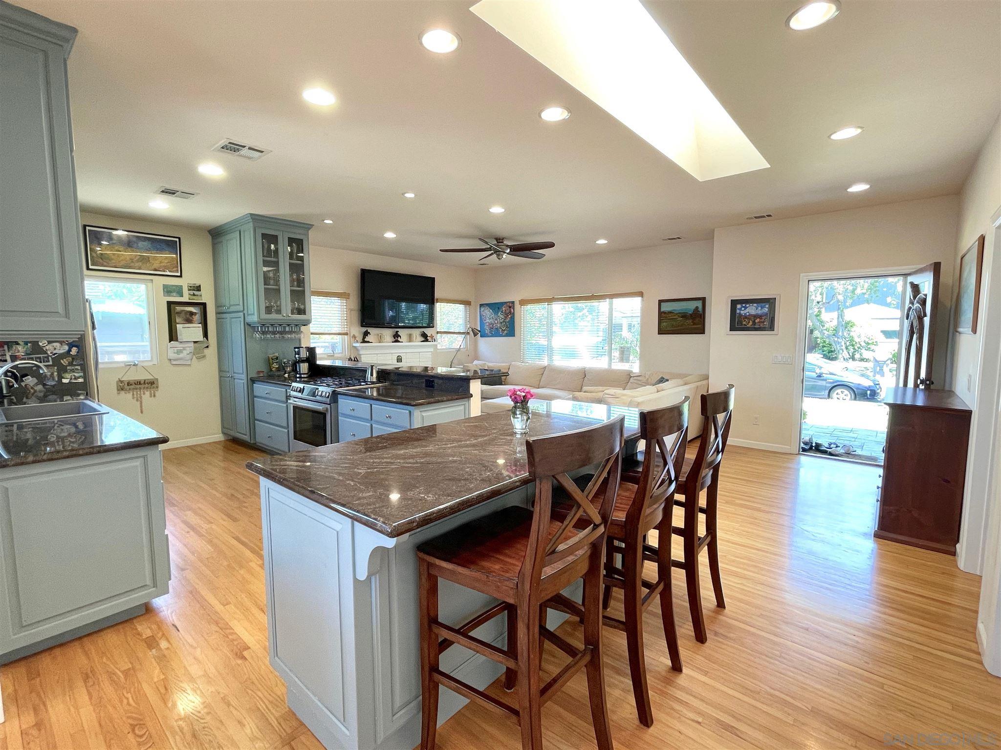 950 Cabrillo Avenue Coronado, CA 92118 - Photo 10 of 31 a kitchen with stainless steel appliances granite countertop table chairs sink and stove