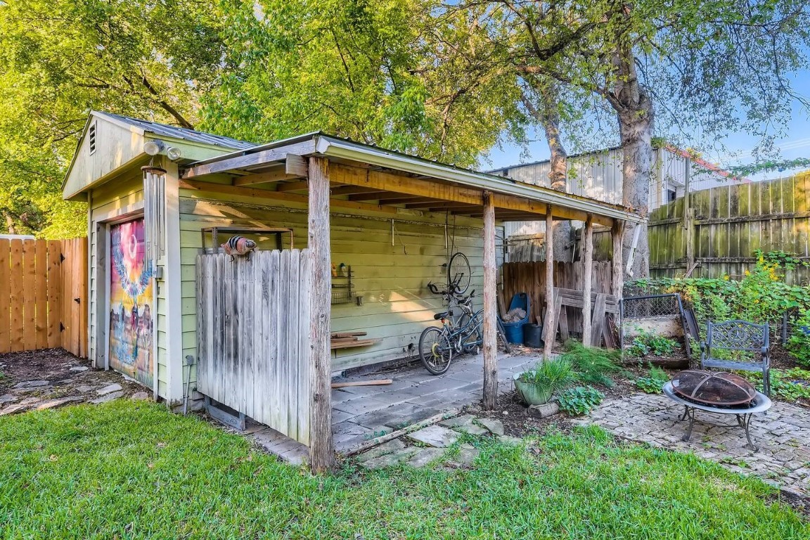 2704 Stacy Lane Austin, TX 78704 - Photo 15 of 15 View of outdoor structure with a fenced backyard and an outdoor fire pit