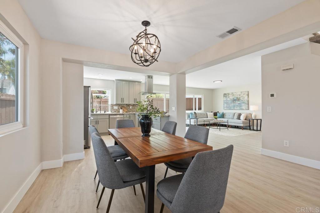 536 Heather Ridge Road San Marcos, CA 92078 - Photo 13 of 66 a view of a dining room with furniture window and wooden floor