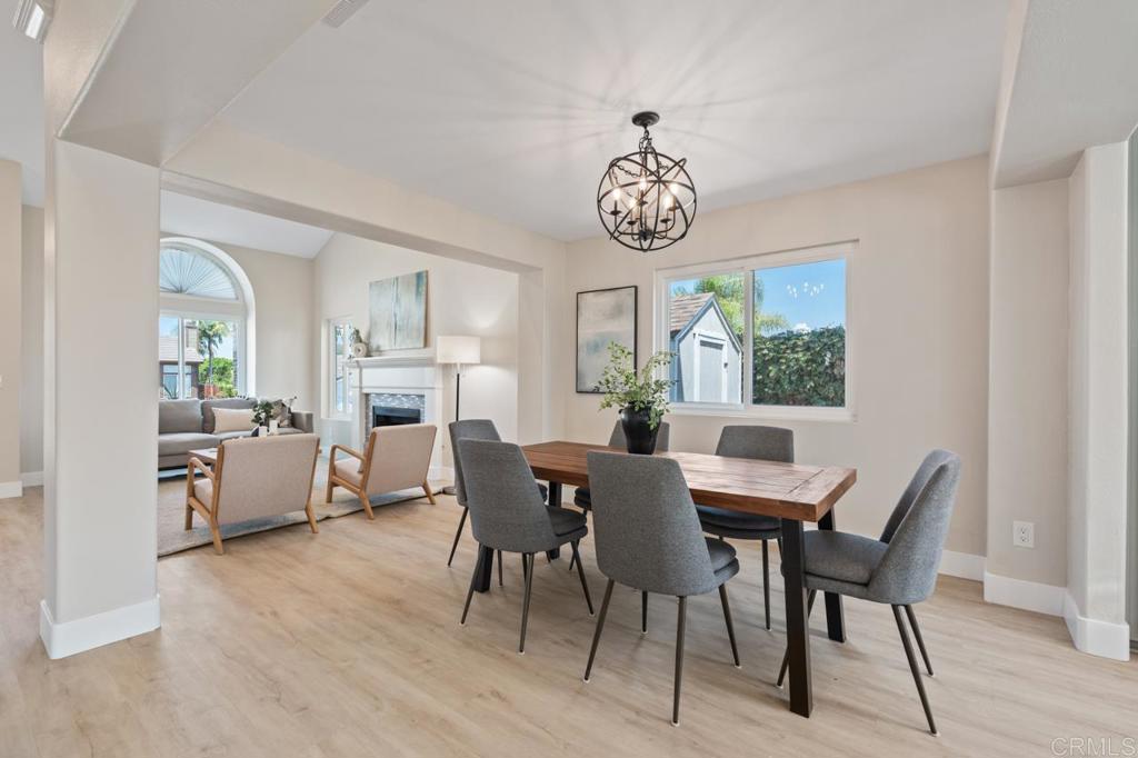 536 Heather Ridge Road San Marcos, CA 92078 - Photo 16 of 66 a view of a dining room with furniture wooden floor and a chandelier