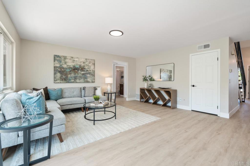 536 Heather Ridge Road San Marcos, CA 92078 - Photo 28 of 66 a living room with furniture and a table with wooden floor