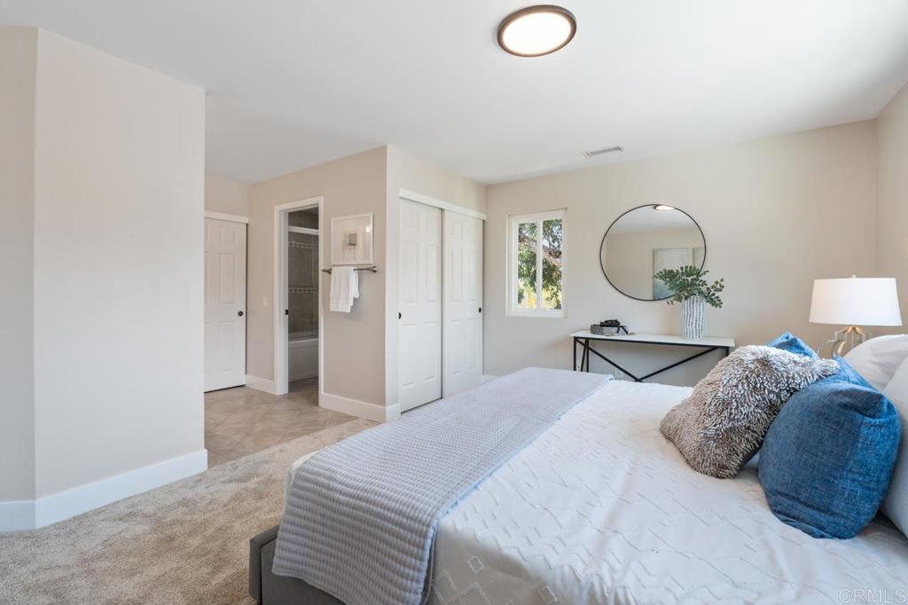 536 Heather Ridge Road San Marcos, CA 92078 - Photo 38 of 66 a bedroom with a bed and a lamp