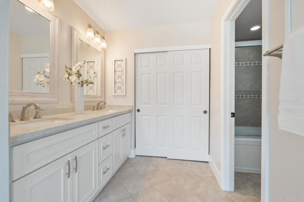 536 Heather Ridge Road San Marcos, CA 92078 - Photo 41 of 66 a spacious bathroom with a double vanity sink a mirror and a shower