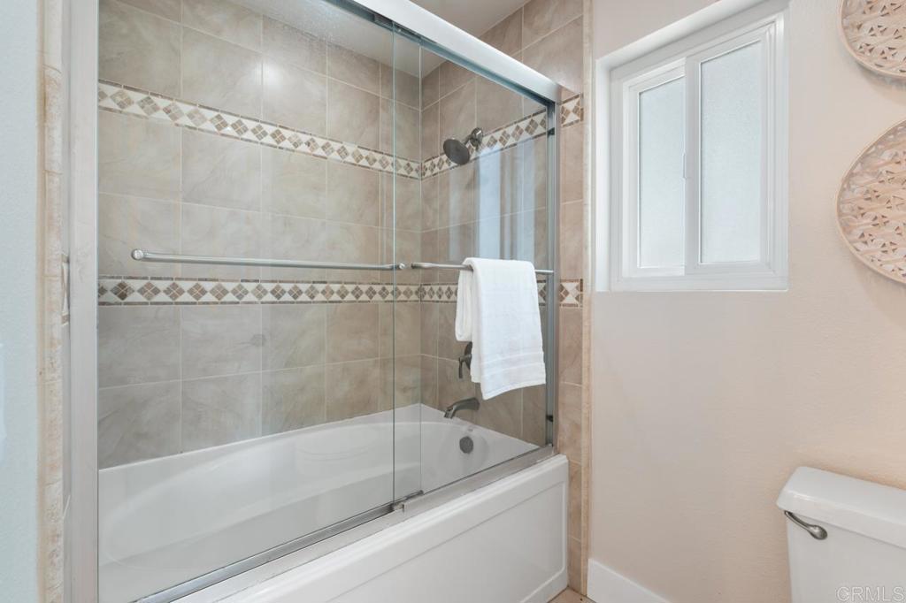 536 Heather Ridge Road San Marcos, CA 92078 - Photo 43 of 66 a bathroom with a bath tub and a shower