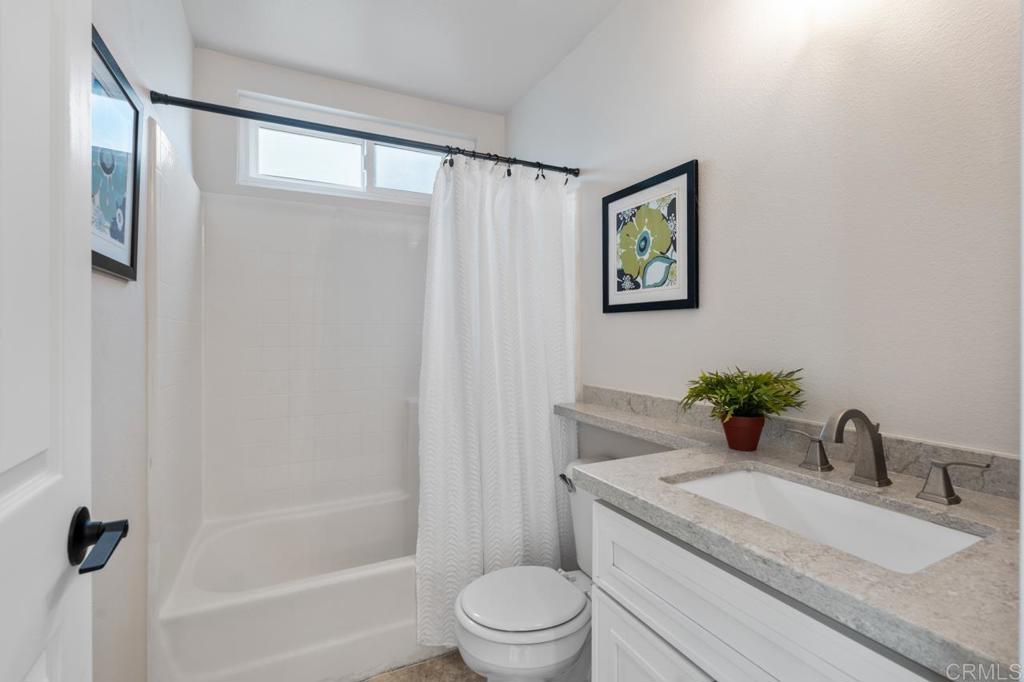 536 Heather Ridge Road San Marcos, CA 92078 - Photo 47 of 66 a bathroom with a granite countertop sink toilet and shower